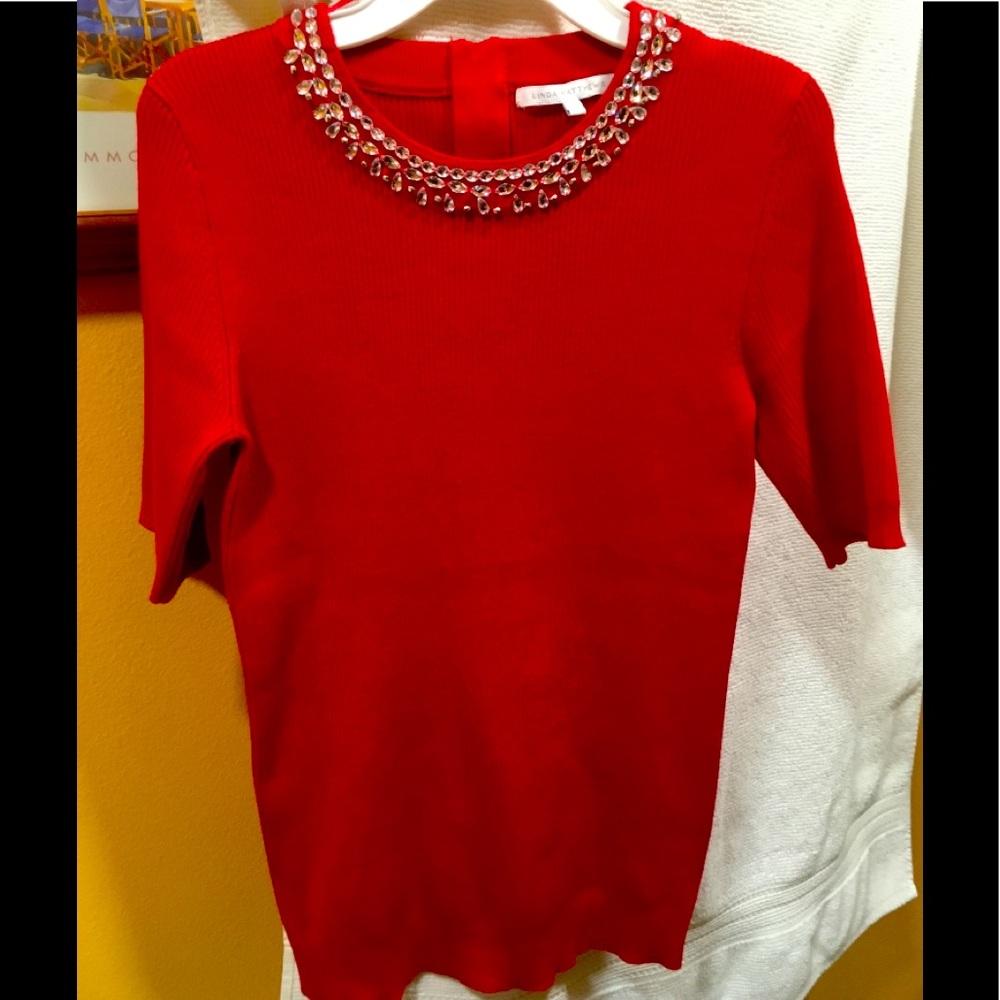 Linda Matthews red knit top with rhinestones